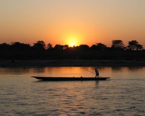 Boat on a river at sunset